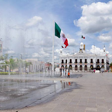 Villahermosa, Mexico - September 8, 2013: The recently renovated Plaza de Armas, the main square in Villahermosa, Tabasco State, on a cloudy sunday. Some kids are playing in the fountain.