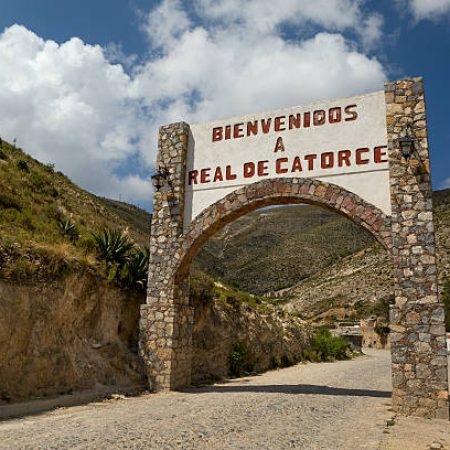 Real de Catorce arched welcome sign in the state of San Luis de Potosi, Mexico, May 22, 2014. An abandoned  former silver mining town at high altitude, today a tourist attraction. Home of the Parish of Immaculate Conception and peyote, the magical cactus, a sacred nourishment.