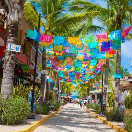 Sayulita, Mexico-October 6, 2017:  Sayulita is a village on Mexico's Pacific coast backed by the Sierra Madre Occidental mountains. It is known for its' beaches with strong surf. Galleries sell artworks by Huichol indigenous people and local homemade wares. Shot taken with Canon 5D Mark lV.